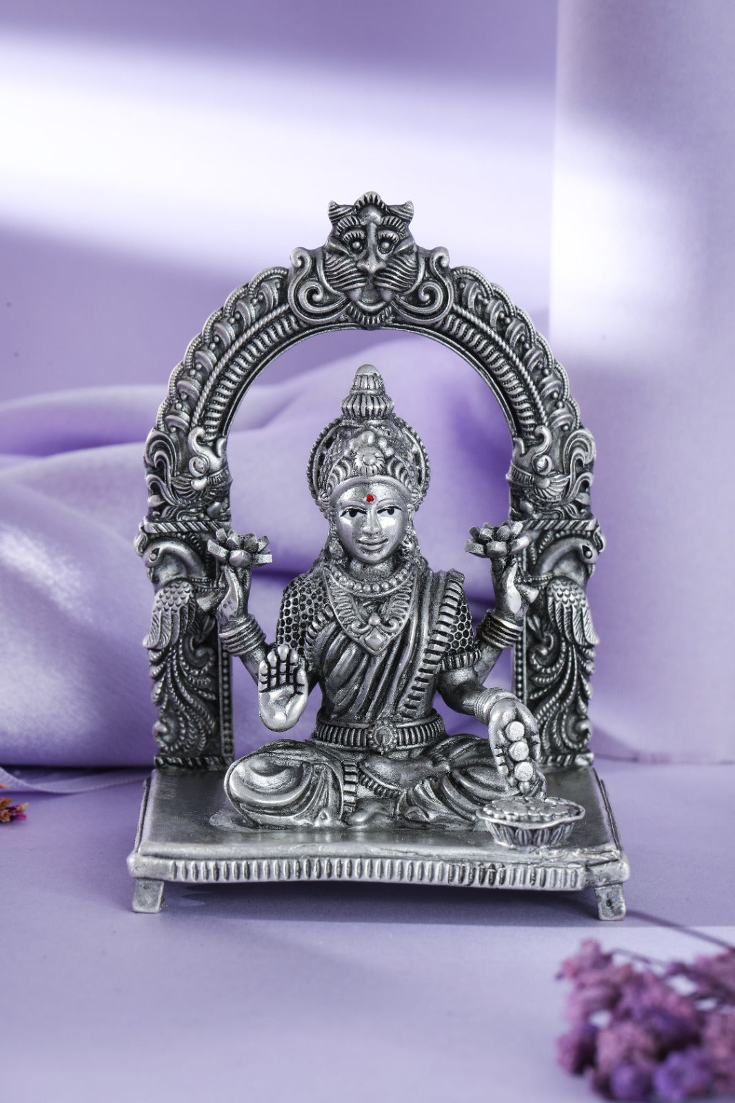 Silver-tone Goddess Lakshmi idol with lotuses and coin bowl