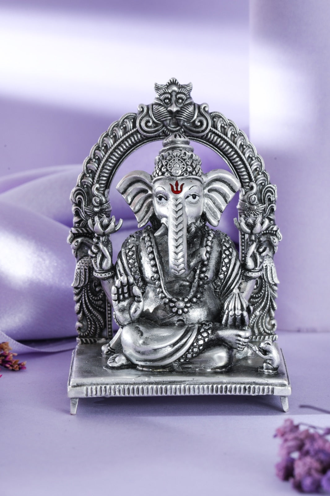 Silver-tone Lord Ganesha idol with ornate arch
