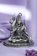 Silver-tone meditating Lord Shiva idol with trishul